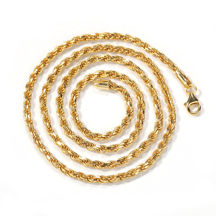 Gold-tone rope chain coiled on white