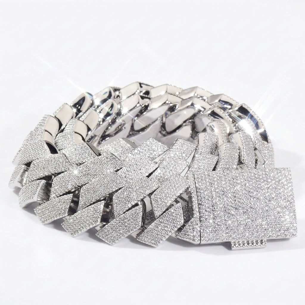 Silver-tone stone-set Cuban links coiled with a pavé box clasp