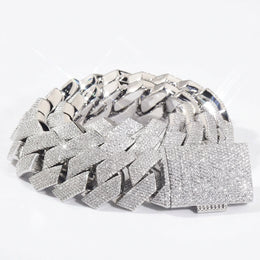 Silver-tone stone-set Cuban links coiled with a pavé box clasp