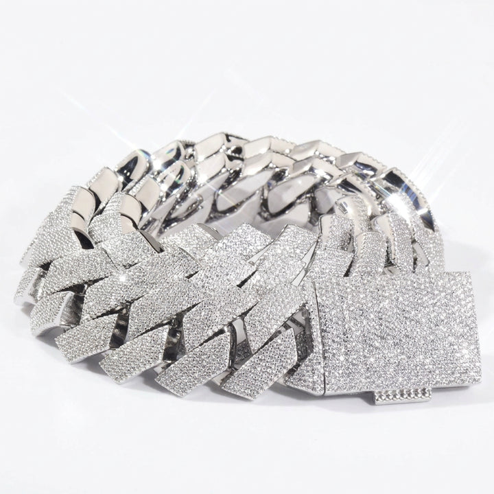 Silver-tone stone-set Cuban links coiled with a pavé box clasp