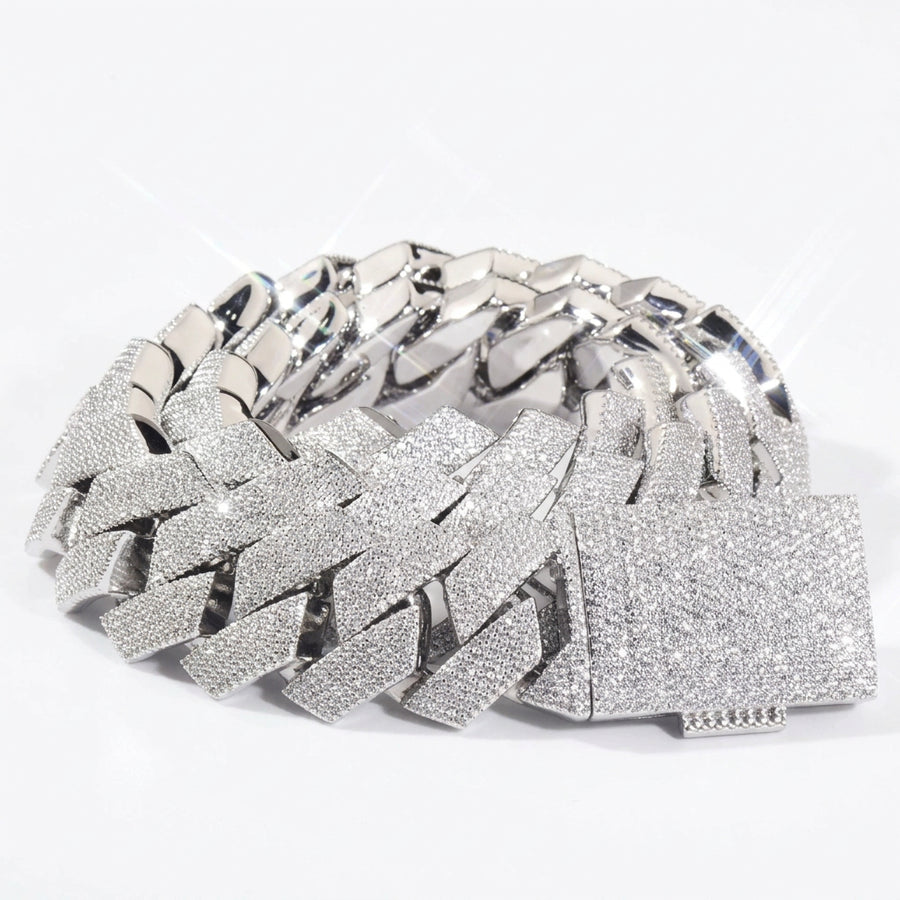 Silver-tone stone-set Cuban links coiled with a pavé box clasp
