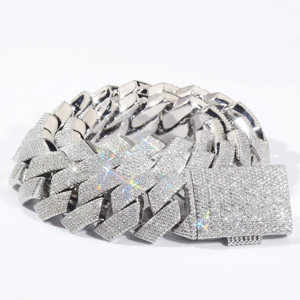 Silver-tone stone-set Cuban links coiled with a pavé box clasp