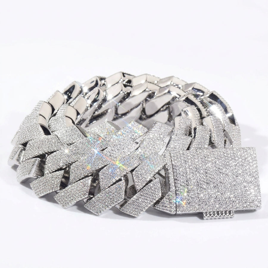 Silver-tone stone-set Cuban links coiled with a pavé box clasp