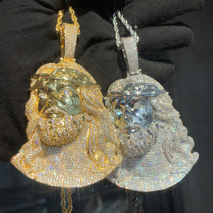 Gold-tone and silver-tone Jesus portrait pendants shown together