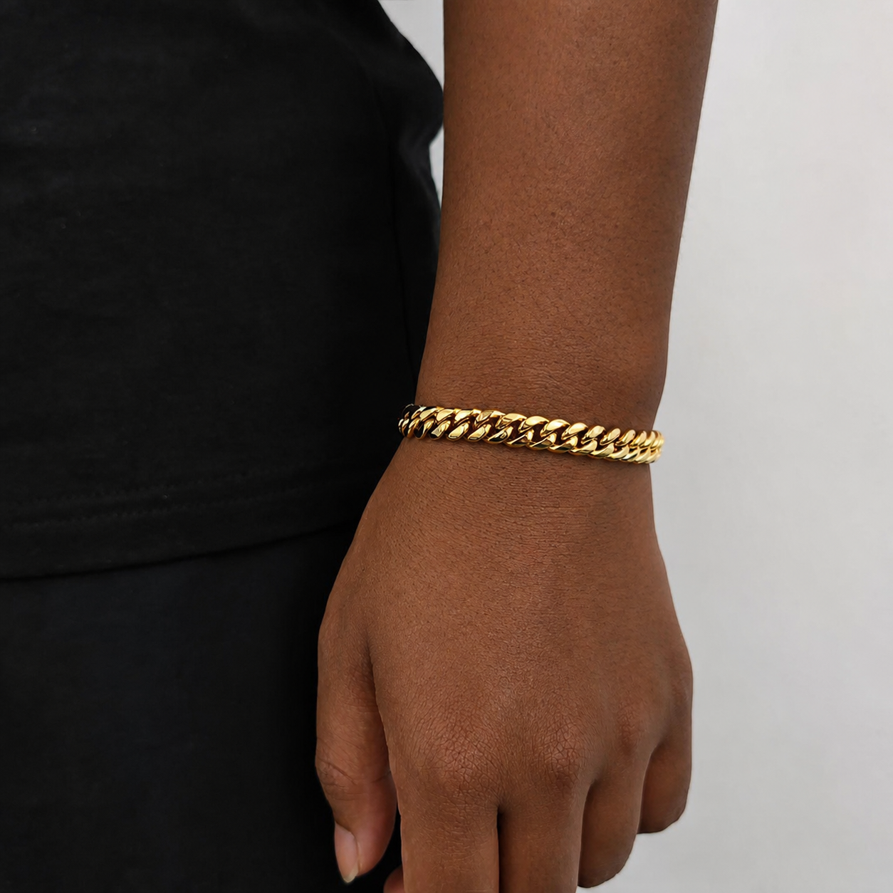 8mm gold Miami Cuban link bracelet on natural deep brown skin