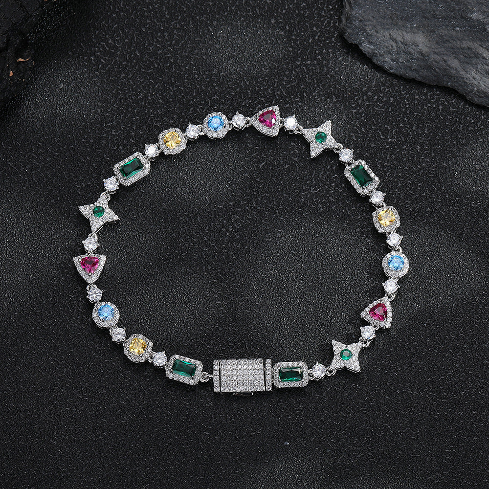 Silver-tone multicolor geometric bracelet on a dark surface