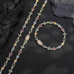 Gold-tone geometric bracelet beside a matching necklace