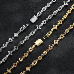 Back of silver and gold-tone geometric links and box clasps