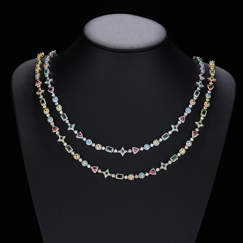 Silver and gold-tone multicolor geometric necklaces on a display bust