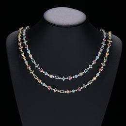 Silver and gold-tone multicolor geometric necklaces on a display bust