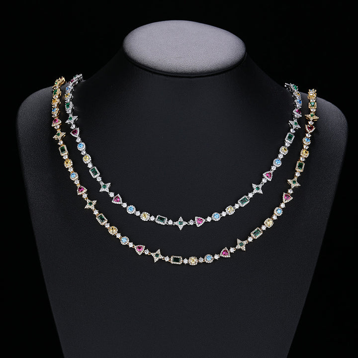 Silver and gold-tone multicolor geometric necklaces on a display bust