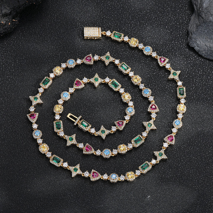 Gold-tone multicolor geometric necklace laid on a dark surface