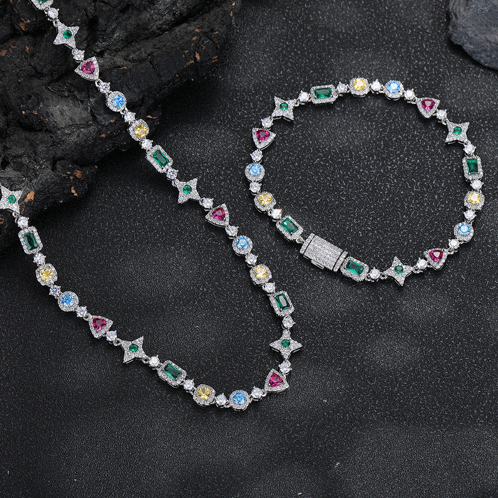 Silver-tone geometric necklace beside a matching bracelet