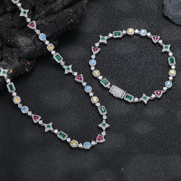 Silver-tone geometric necklace beside a matching bracelet