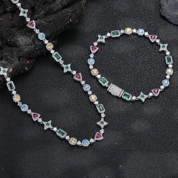 Silver-tone geometric necklace beside a matching bracelet