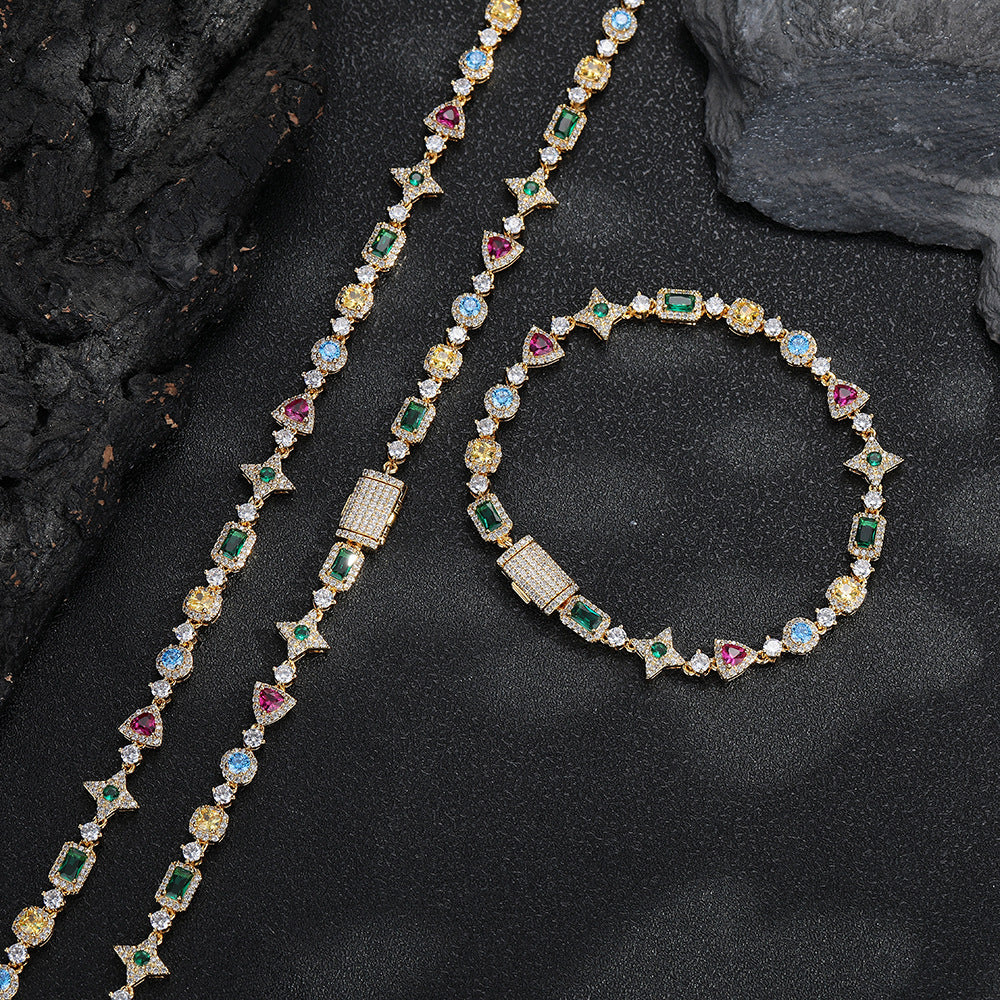 Gold-tone geometric necklace beside a matching bracelet
