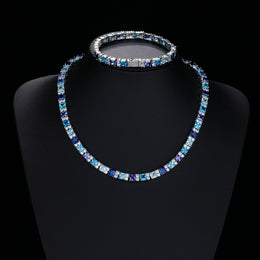 Multicolor tennis necklace and matching bracelet on display busts