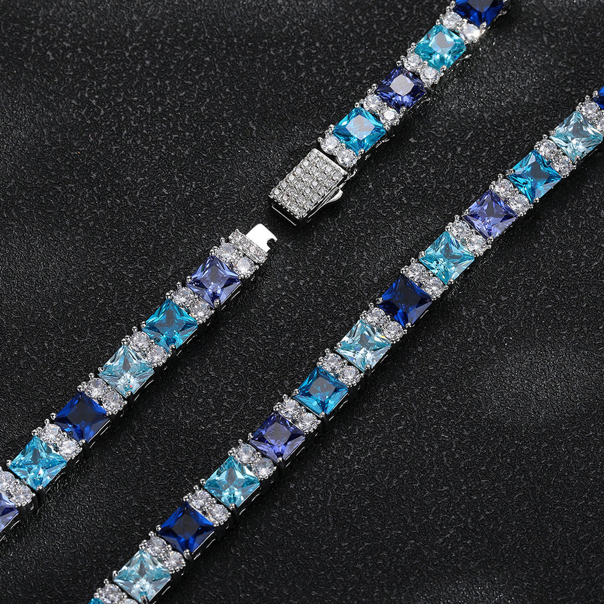 Close-up of two multicolor square-cut tennis chains