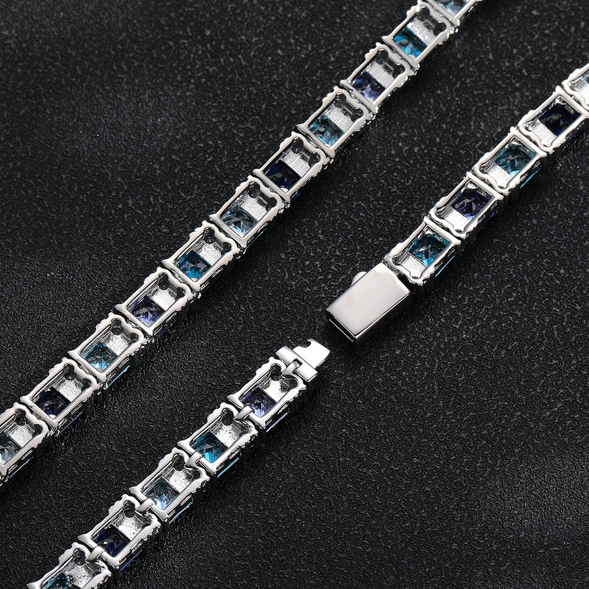 Back and clasp view of two multicolor tennis chains