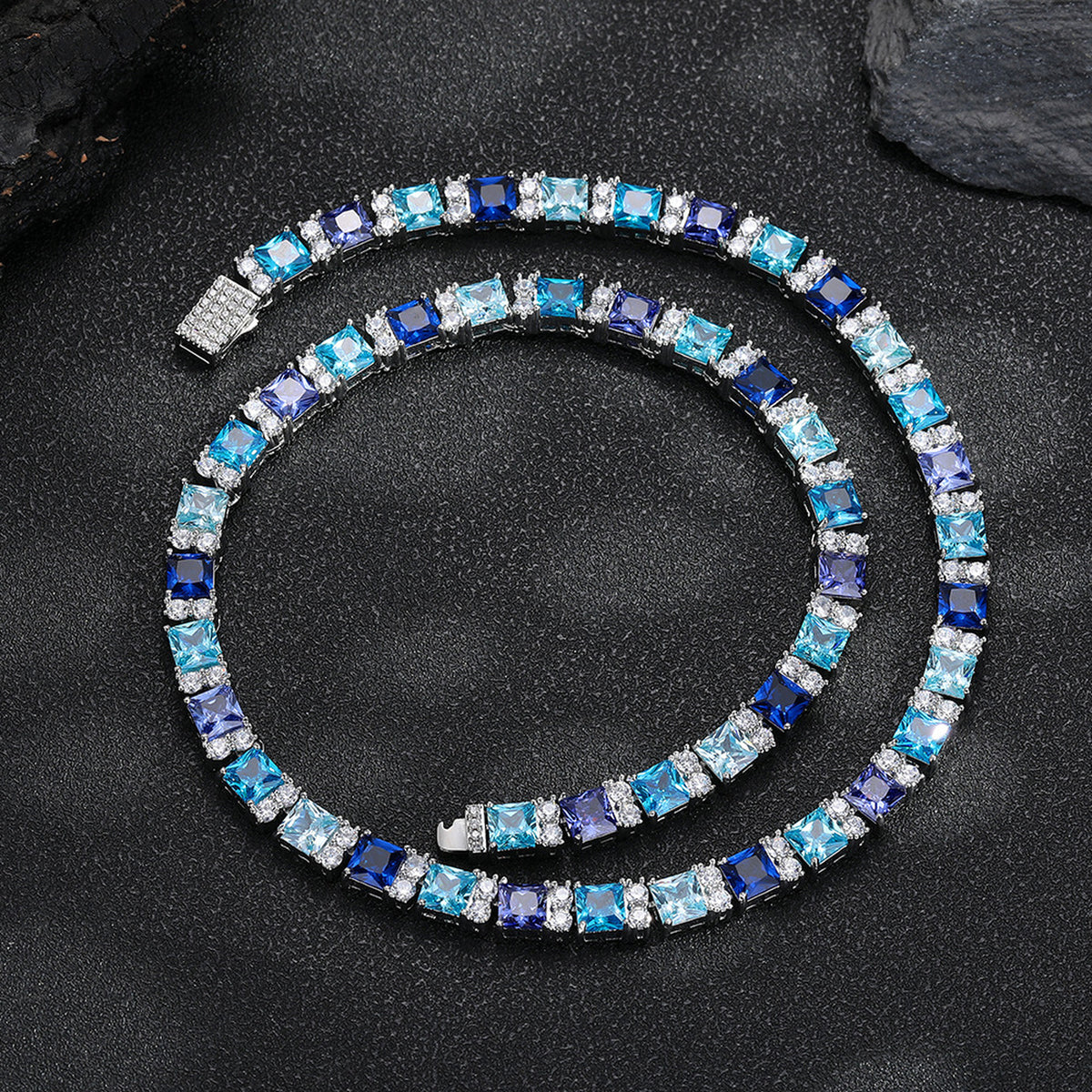 Multicolor square-cut tennis necklace arranged on black