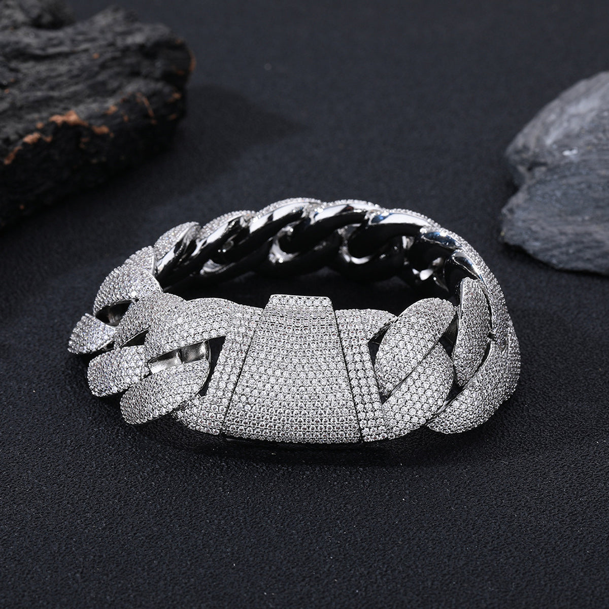 Silver iced Bubble Cuban link bracelet on black stone