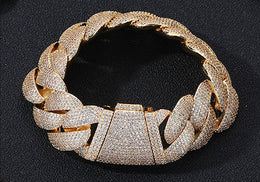 Gold iced Bubble Cuban link bracelet top view on black