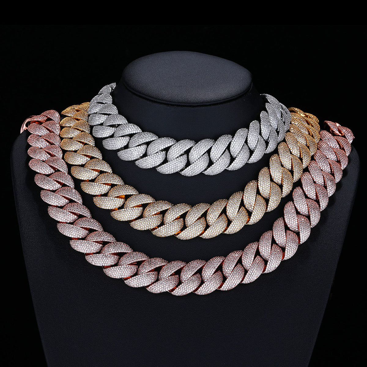 Silver Gold and Rose Gold iced Bubble Cuban necklaces on a display bust