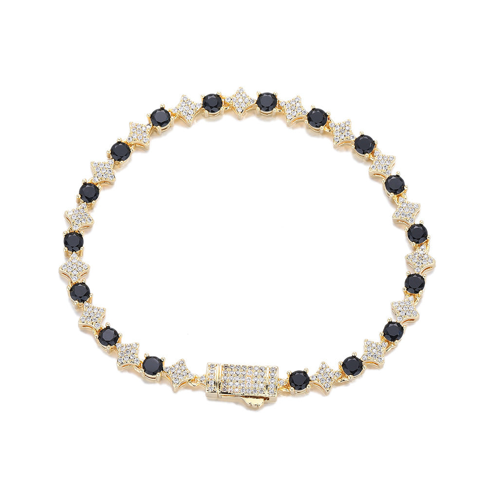 Gold-tone black stone star tennis bracelet on white