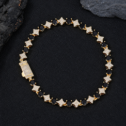 Gold-tone black round stone and clear star link bracelet with a box clasp on black fabric
