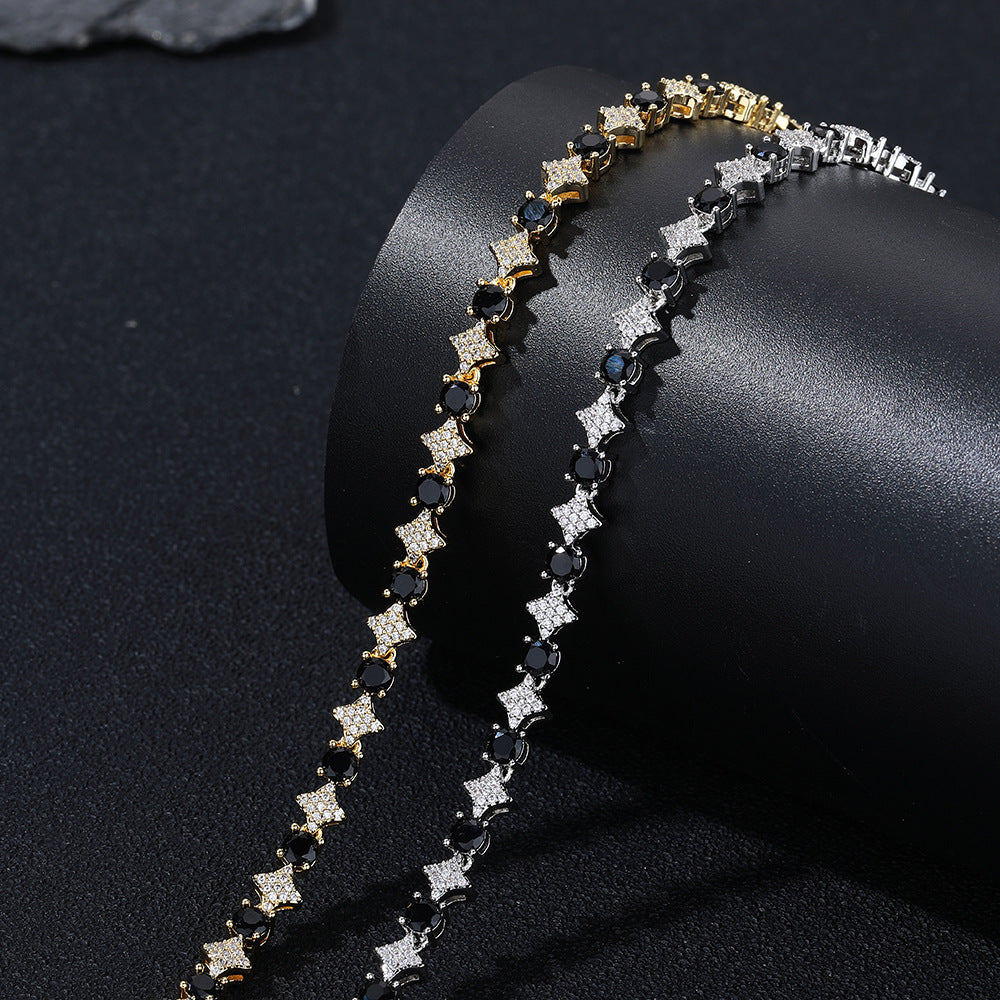 Silver and Gold bracelet links with black round stones and clear pavé stars on a black roll