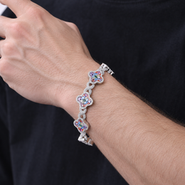 Model wearing a silver-tone multicolor zircon clover bracelet