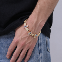 Model wearing a gold-tone multicolor zircon clover bracelet