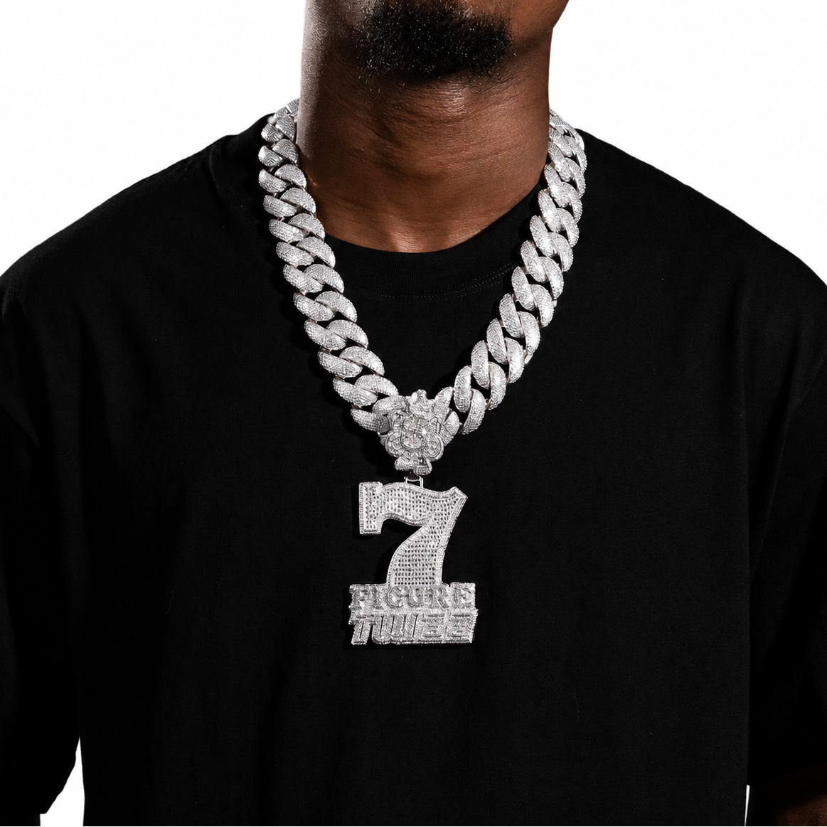 Silver iced 7 Figure Twizz pendant displayed with Cuban links