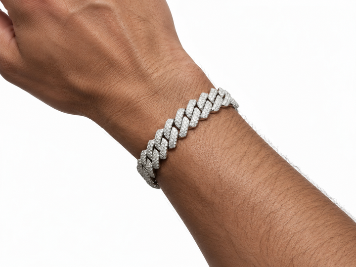 13mm Silver-tone iced-out Cuban link bracelet worn on a man’s wrist against a clean white background.