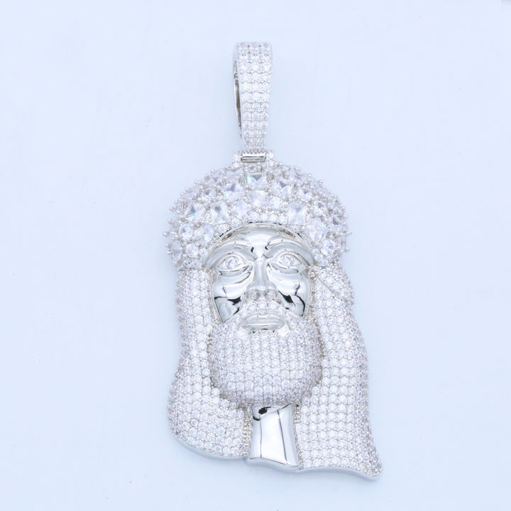 Silver-tone bearded portrait pendant with a stone-set head covering