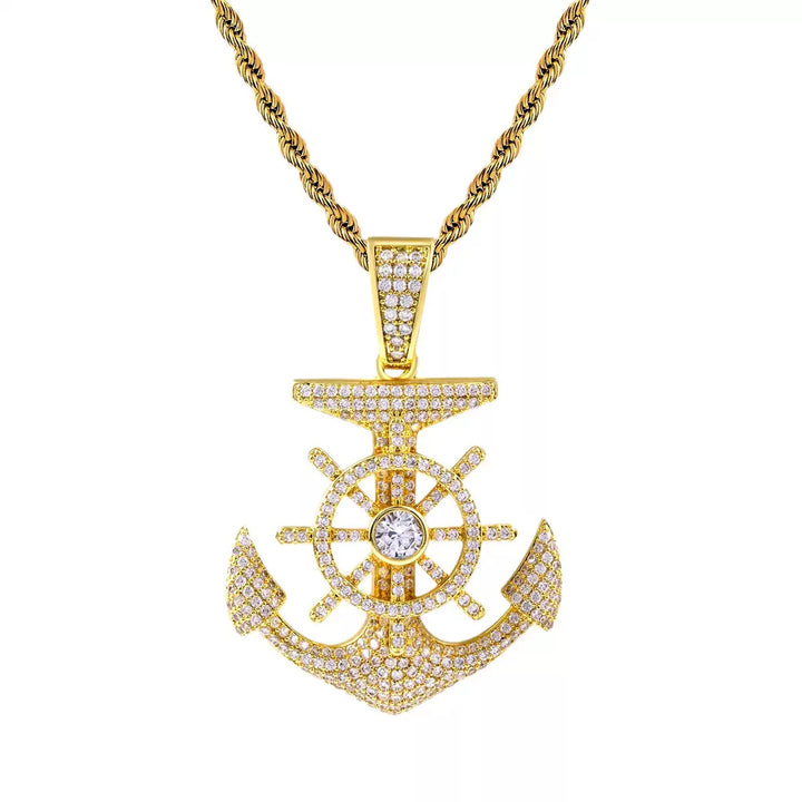 Gold-tone stone-set anchor and ship's wheel pendant on a rope chain
