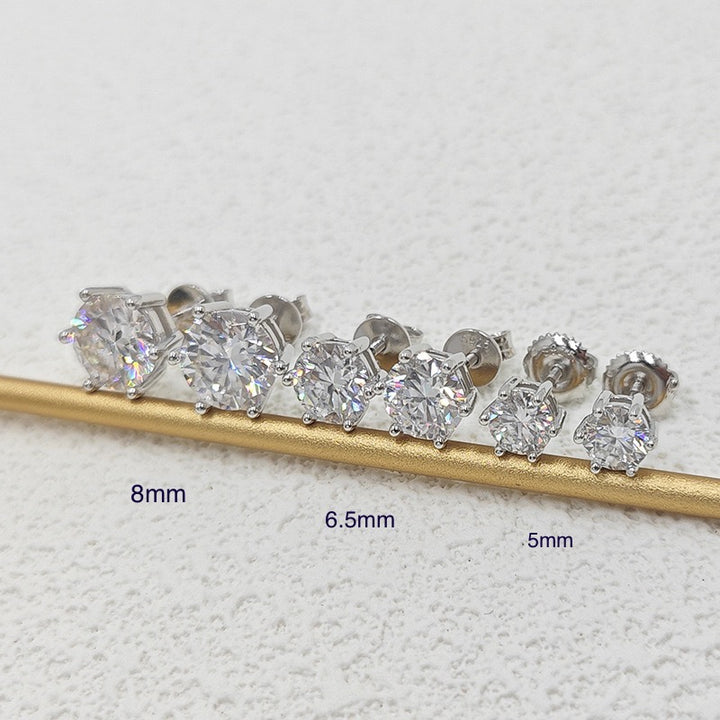 Round stud earrings on a display bar comparing sizes labelled 8mm, 6.5mm and 5mm