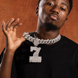 Model holding silver iced 7 Figure Twizz pendant