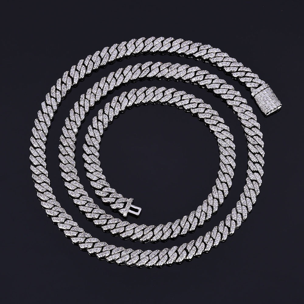 Cuban link chain with sparkling stones on a black background - Miles Jewellery