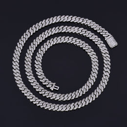 Cuban link chain with sparkling stones on a black background - Miles Jewellery
