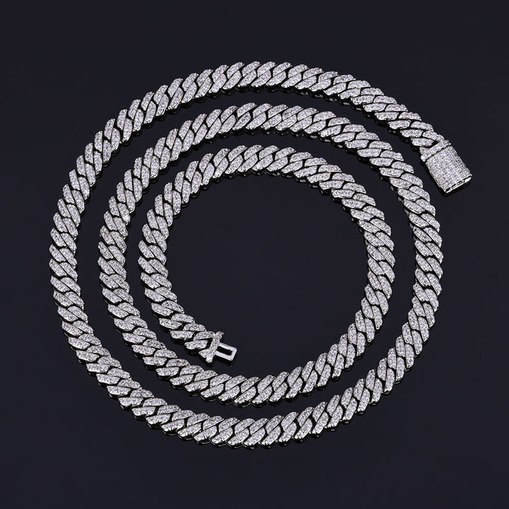 Cuban link chain with sparkling stones on a black background - Miles Jewellery