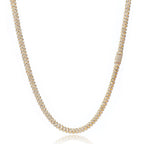Gold iced out tennis chain necklace with sparkling stones on white background - Miles Jewellery