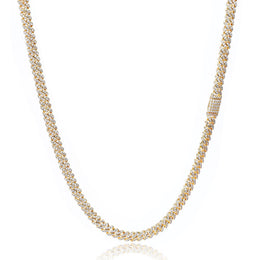 Gold iced out tennis chain necklace with sparkling stones on white background - Miles Jewellery