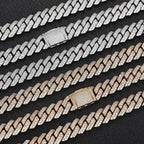 Iced out Cuban link chains in silver and gold with diamond detailing on black background - Miles Jewellery