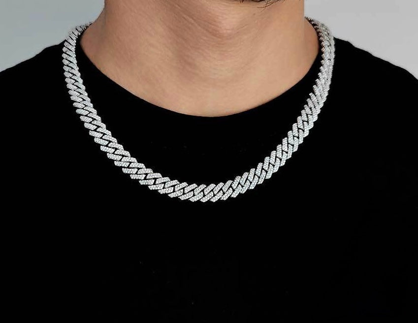 Iced out Cuban link chain necklace on man wearing black shirt - Miles Jewellery
