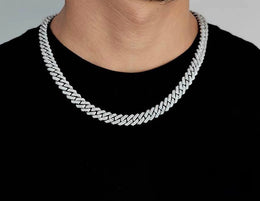 Iced out Cuban link chain necklace on man wearing black shirt - Miles Jewellery