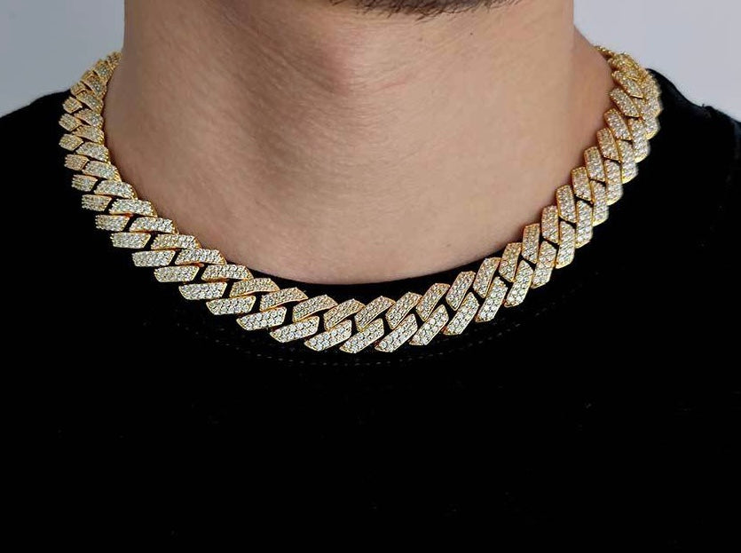 Gold cuban link chain encrusted with diamonds worn on neck, hip hop jewelry style - Miles Jewellery
