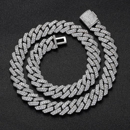 Iced out Cuban link chain with clear stones on black background - Miles Jewellery