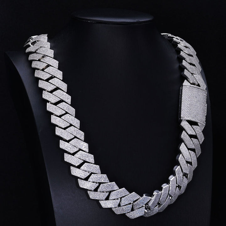 Silver-tone stone-set Cuban link necklace on a black display bust