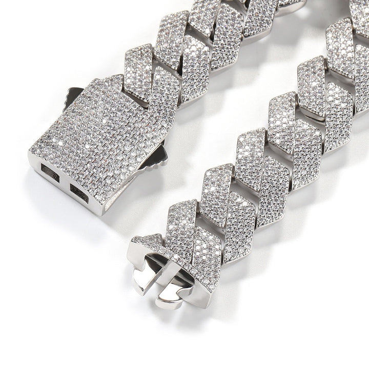Silver-tone stone-set Cuban link chain showing the open clasp